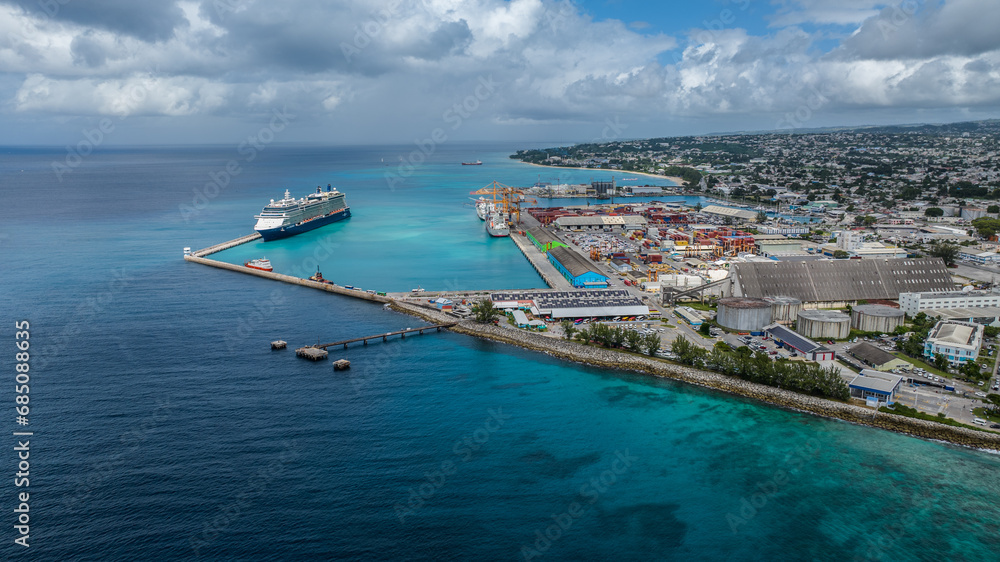 aerial landscape view of area around the port of Bridgetown, Barbados, a multipurpose seaport with a cruise ship and two vessels moored 
