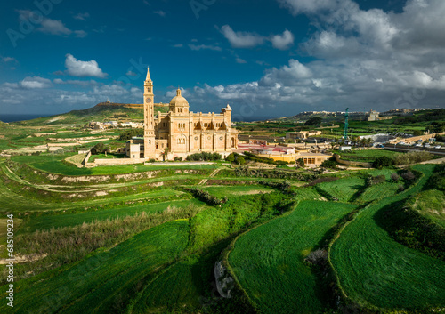 Aerial Drone photo of The Sanctuary of Ta’ Pinu in Gozo, Malta—a revered pilgrimage site with spiritual significance.