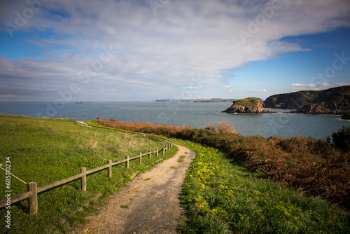 Hiking path with the sea in the background in Castrillon, Asturias
 photo