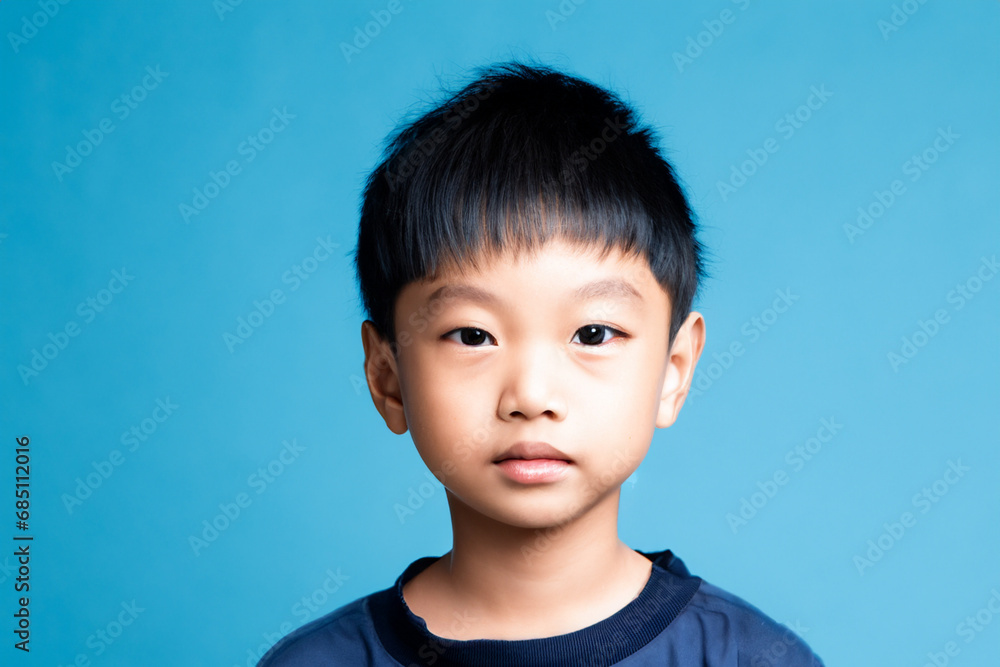 boy from Japan. asian boy closeup on color blue background. asian countries concept boy from Japan. asian boy closeup on color blue background. asian countries concept