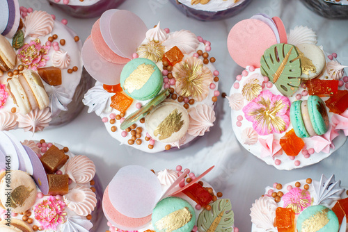 Beautiful traditional Orthodox Easter cakes decorated with glaze, meringues, chocolate, nuts, toffees, macaroons, flowers and jelly