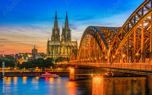 Cologne Koln Germany during sunset, Cologne Hohenzollern bridge with the cathedral in the background during sunset. beautiful sunset at the Rhine River photo