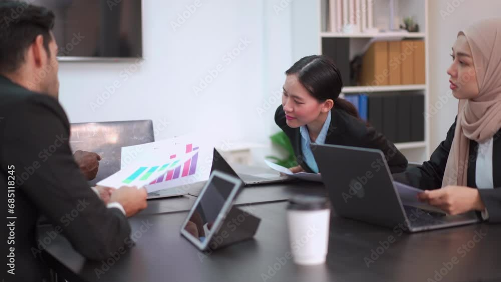 Businesspeople in meeting room discussing about annual business plan or sales report. Businesspeople in meeting room discussing about annual business plan or sales report.