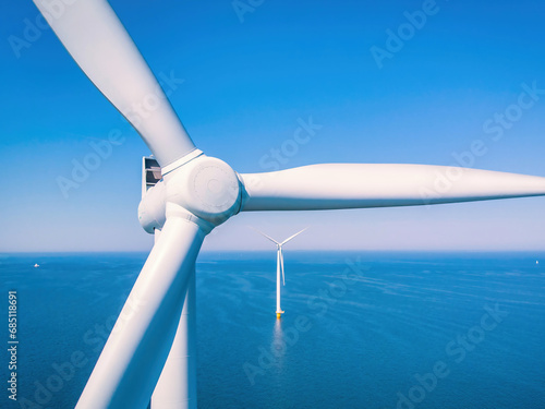 Wind turbine from aerial view, Drone view at windmill park Westermeerdijk a windmill farm in the lake IJsselmeer the biggest in the Netherlands, Sustainable development, renewable energy Netherlands