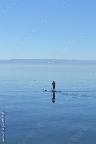doing paddle board in the pacific ocean in Chile
