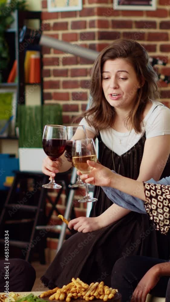 Vertical video Multiracial group of people celebrating their friendship together, toasting wine and champagne glasses at home party. Joyful friends having reunion gathering, enjoying alcoholic drinks Vertical video Multiracial group of people celebrating their friendship together, toasting wine and champagne glasses at home party. Joyful friends having reunion gathering, enjoying alcoholic drinks