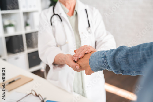 Care and patients. Doctor touching patient`s hand. Recuperation and healing process. Psychotherapy and diagnosis. Cancer treatment. Support and hope