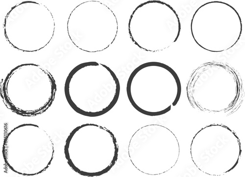 Vector circles with a brush on a white background. Circles drawn with a black brush on a white background. Illustration of various circles in the grunge style in black. Abstraction of dirty rings EPS