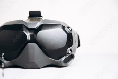 Close-up of black virtual reality glasses on a white background. Glasses for controlling drones. Front view