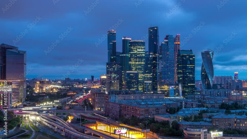 Night to day transition view of the city traffic timelapse and Skyscrapers of Moscow International Business Center (Moscow-City). Aerial top view from rooftop near Kievskiy railway station Night to day transition view of the city traffic timelapse and Skyscrapers of Moscow International Business Center (Moscow-City). Aerial top view from rooftop near Kievskiy railway station
