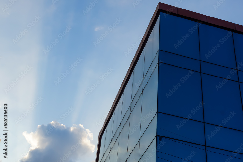 Fototapeta premium glass buildings with cloudy blue sky background