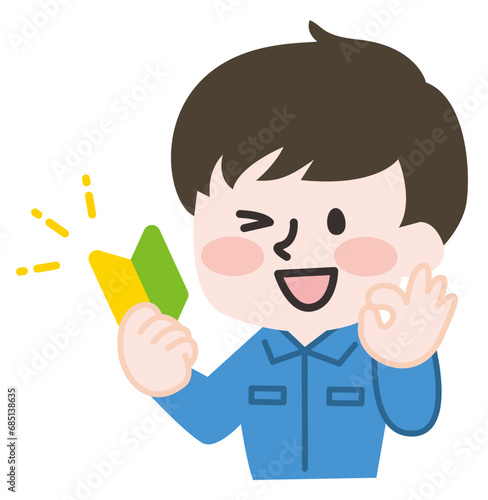 初心者マークを持つ作業員