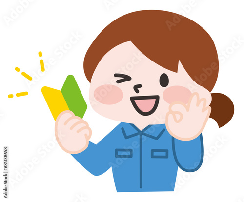 初心者マークを持つ作業員
