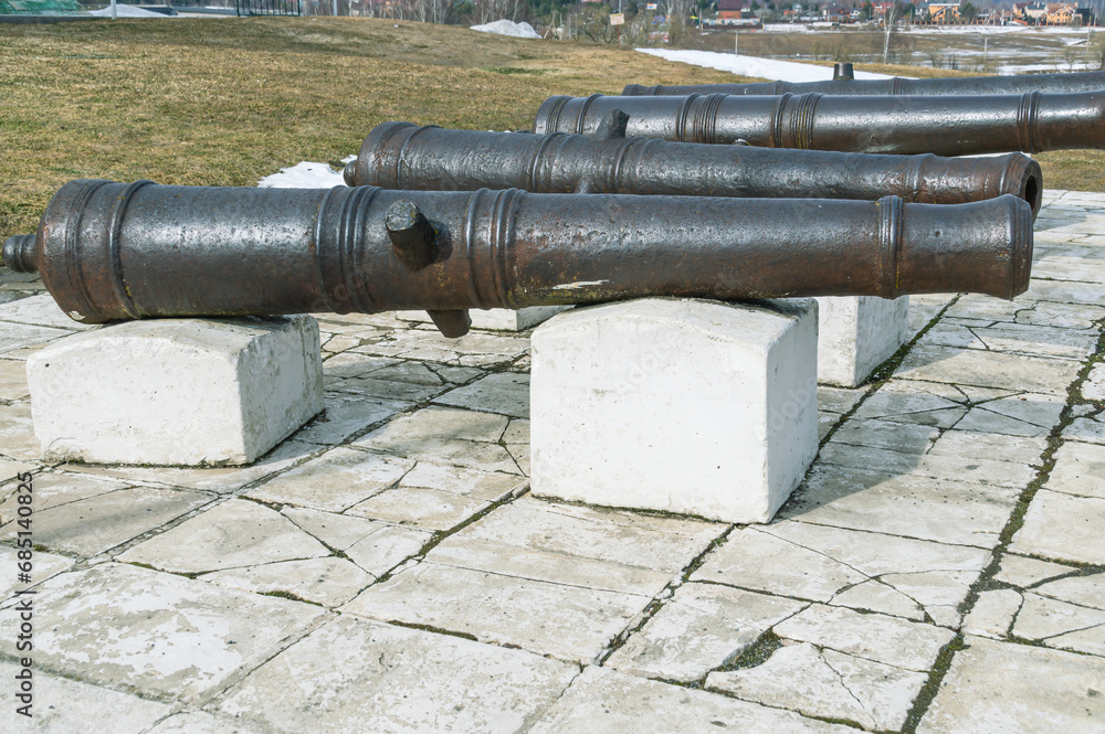 Antique cast iron cannons for firing cores. Ancient weapons for war and defense against attacks. Antique cast iron cannons for firing cores. Ancient weapons for war and defense against attacks.