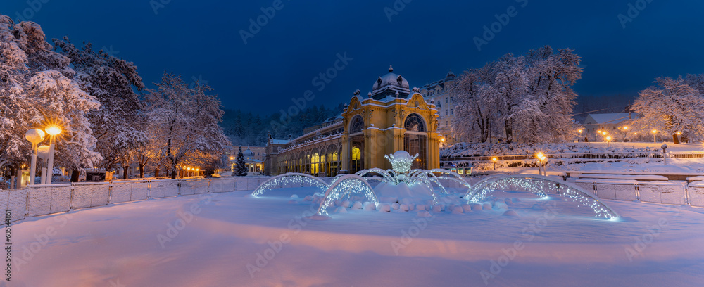 Main colonnade and singing fountain in winter with snow, early morning photography - spa town Marianske Lazne (Marienbad) - Czech Republic, Europe