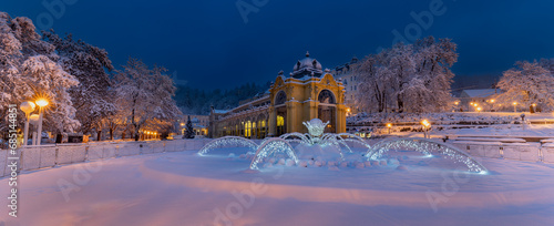 Main colonnade and singing fountain in winter with snow, early morning photography - spa town Marianske Lazne (Marienbad) - Czech Republic, Europe