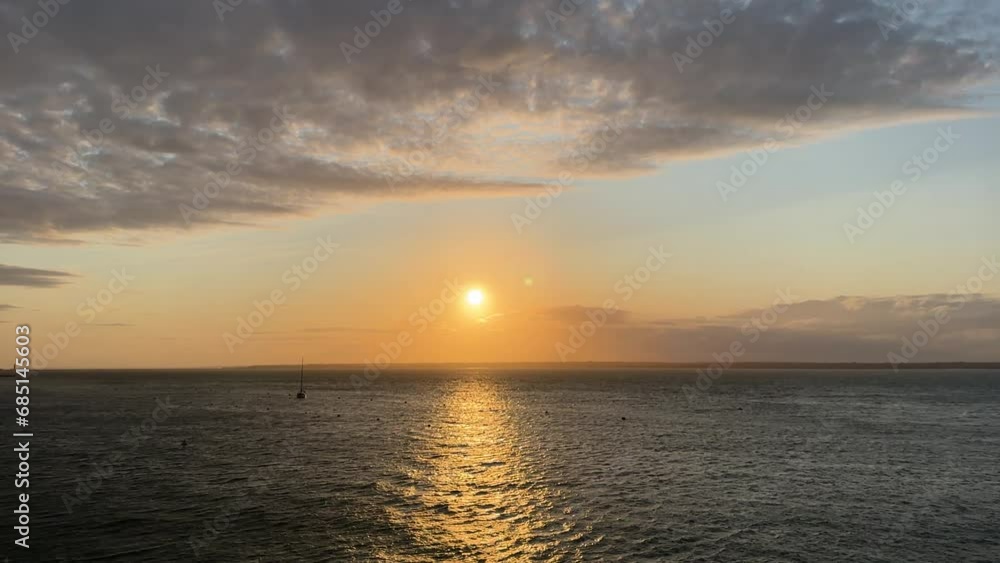Sunset over the sea. Sunlight plays on the sea waves. Sunset over the sea. Sunlight plays on the sea waves.