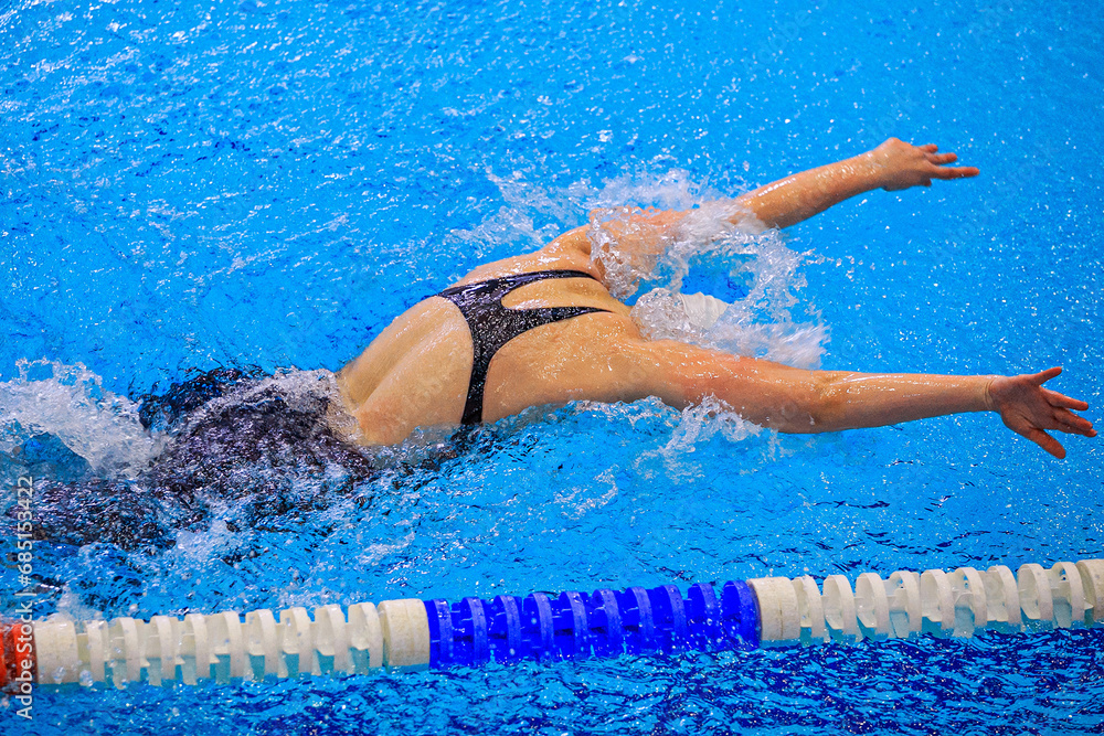 female swimmer swim butterfly stroke competition race, summer sports games