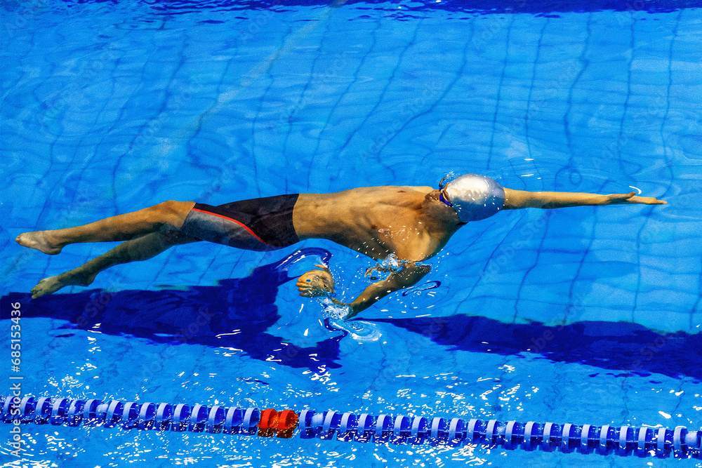 male swimmer swim backstroke in competition race, summer sports games