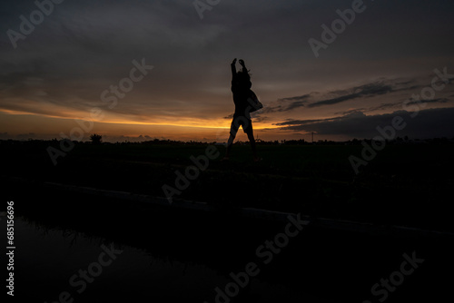 Silhouette photo at sunset with a beautiful sky background