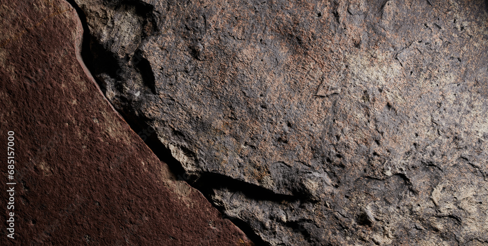 Fototapeta premium Brown stone texture, dark abstract background. Natural mineral rock close up details, empty backdrop with copy space for design
