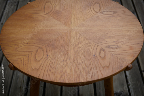 Oak wood tabletop. Oak veneer structure. Rounded table.  photo