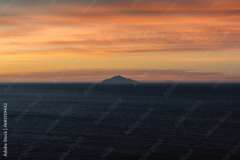 Naklejka premium Tyrrhenian Sea with the island of Pianosa near Elba at sunrise