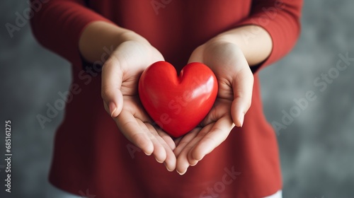 Woman showing red heart in hands  close-up of hands. World Women s Day holiday  love or Valentine s Day concept