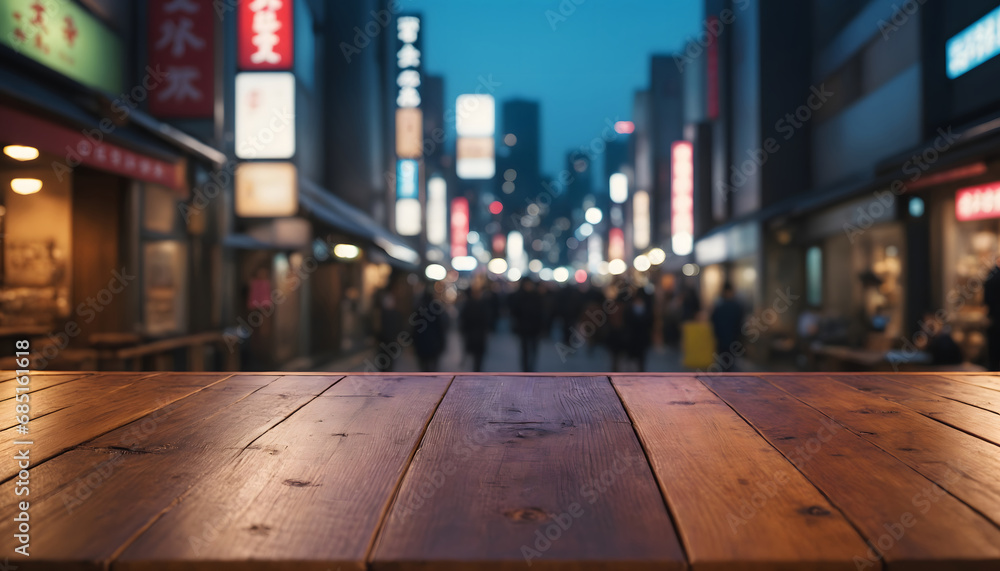 The empty wooden table top with blur background of japan night city The empty wooden table top with blur background of japan night city