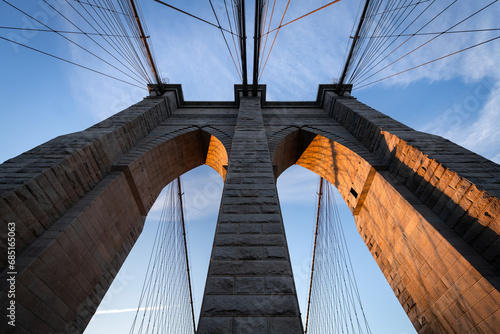 Canvas Print Architectural detail of the Brooklyn Bridge in New York City in the beautiful warm sunrise light