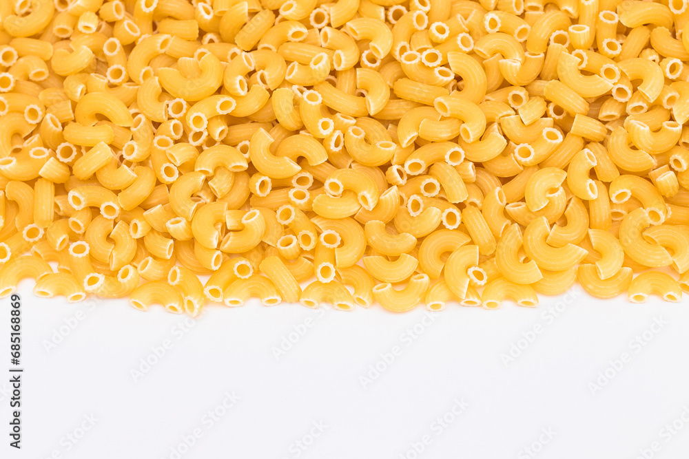 Uncooked Chifferi Rigati Pasta Scattered on White Table. Fat and Unhealthy Food. Classic Dry Macaroni. Italian Culture and Cuisine. Raw Pasta Uncooked Chifferi Rigati Pasta Scattered on White Table. Fat and Unhealthy Food. Classic Dry Macaroni. Italian Culture and Cuisine. Raw Pasta