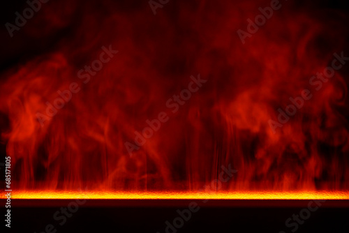 Water red vapor from the humidifier on a black background, closeup. Abstract flowing steam smoke with from the humidifier photo