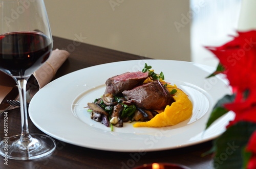 beef fillet mignon with puree on white plate,