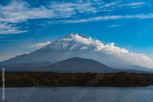 Nature Landscape view of Colorful Autumn Season and Mountain Fuji with morning fog and red leaves at lake Kawaguchiko is one of the best places in Japan