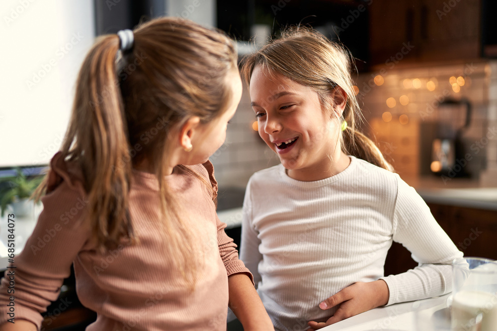 Messy and happy: Laughter fills the air as girls and family share joyful moments at the breakfast table, enjoying the sweet chaos of spreading jam.