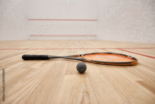 Bilde på lerret ball and racquet on floor inside of indoor squash court, motivation and determin