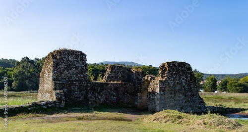 medieval castle ruins in the countryside with blue sky