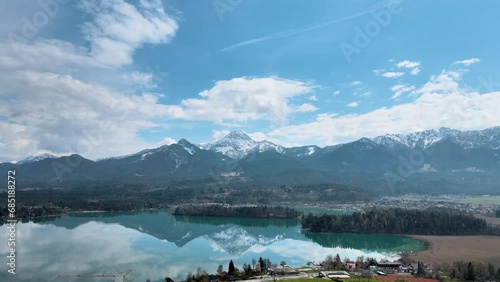 Faaker See, Austria during a calm morning with the reflection of the Mittagskogel mountain photo