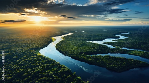 Aerial view of the rainforest and the Amazon River at sunset photo