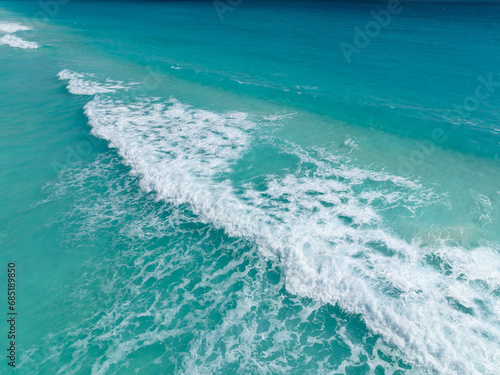 Cancun beach with white sand and blue waves