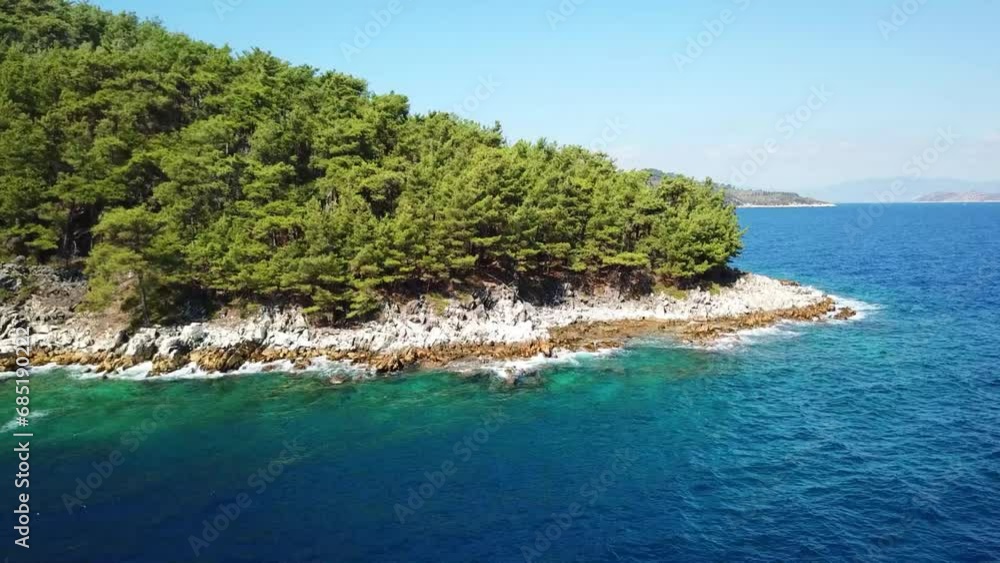 Marble Beach or Saliara Beach in Thassos Island , Greece , well known tourist attraction at Aegean Sea , famous for it's pure white marble sand ,aerial drone footage Marble Beach or Saliara Beach in Thassos Island , Greece , well known tourist attraction at Aegean Sea , famous for it's pure white marble sand ,aerial drone footage
