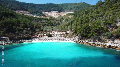 Marble Beach or Saliara Beach in Thassos Island , Greece , well known tourist attraction at Aegean Sea , famous for it's pure white marble sand ,aerial drone footage