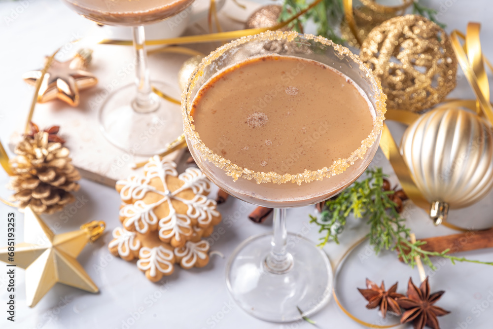 Christmas Gingerbread martini cocktail, spicy winter alcohol cocktail with gingerbread syrup, on New Year Xmas decorated background Christmas Gingerbread martini cocktail, spicy winter alcohol cocktail with gingerbread syrup, on New Year Xmas decorated background