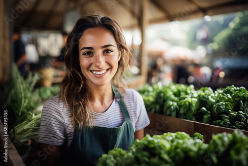 Smiling Friendly female farmer Selling Fresh Local Vegetable at Farmers Market. The concept of healthy eating. Organic farm products. photo