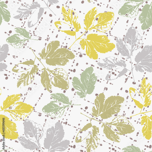 Seamless pattern with leaves. Gray, yellow, green leaves on a white background.