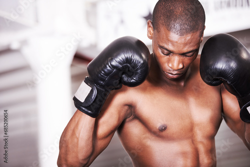 Man, gloves and boxing workout for sports training or competition athlete, fearless fighter for cardio. Black person, fist and power exercise club fit or punch practice or muscle gym, battle in mma