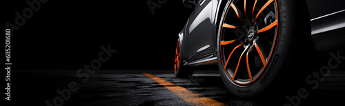 Car tires on black background with copy space, an illustrative concept for auto parts business and car repair shop 