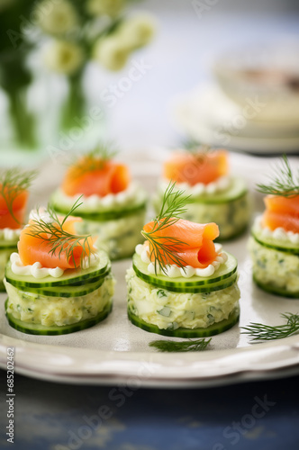 Smoked salmon, cucumber and potato bites on a tray. Vertical, close-up, side view.
