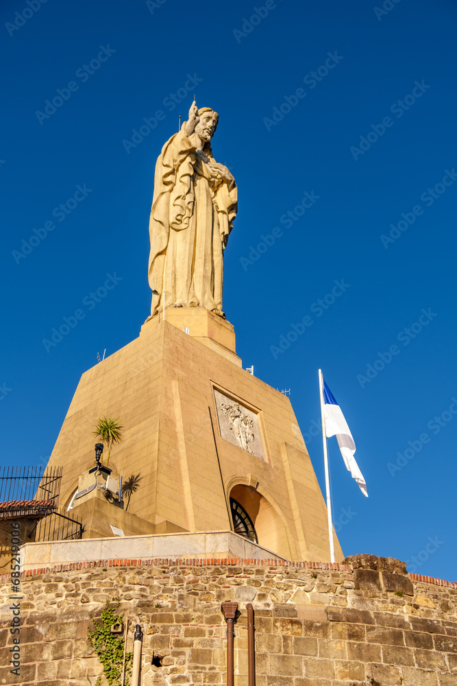 Statue of Jesus at the top of Mount Urgul in San Sebastian, Spain.