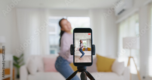 Asia vlogger woman influencer smile enjoy hobby happy fun live online screen IG reel tiktok at home. Gen Z teen girl talent people play video selfie camera shoot instagram app show share viral story. photo